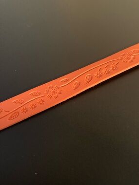 paparazzi Orange Wrist Strap with Pink Logo Charm